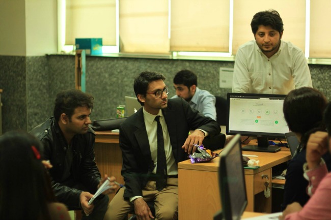 men having a meeting in a research lab in Pakistan